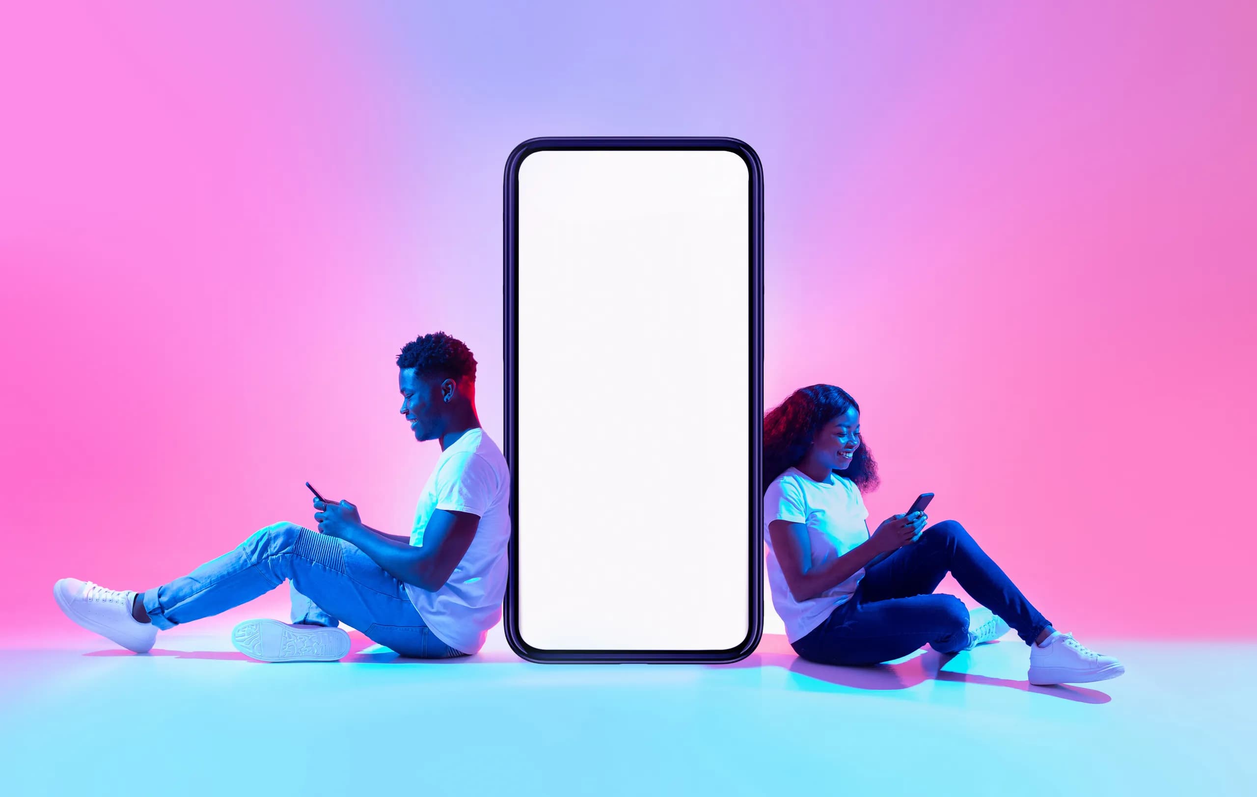 Two people reviewing a website on a phone